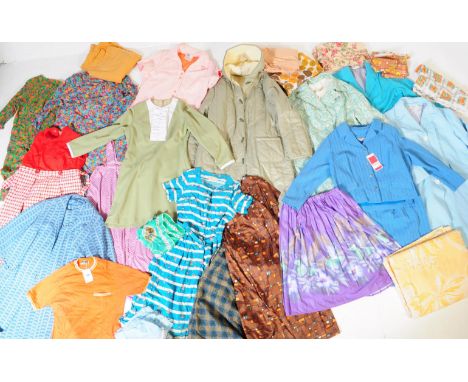 An assortment of vintage mid 20th century circa 1950s &amp; later women's fashion dresses &amp; garments. The lot to include 