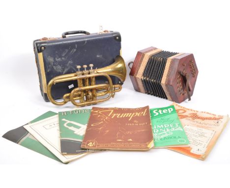 A vintage 20th century Renown brass trumpet musical instrument in blue case and a squeeze box.