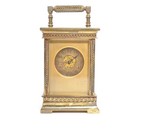 A 19th century French brass gorge cased carriage clock. The clock face having Arabic numeral to chapter ring with ebonised ha
