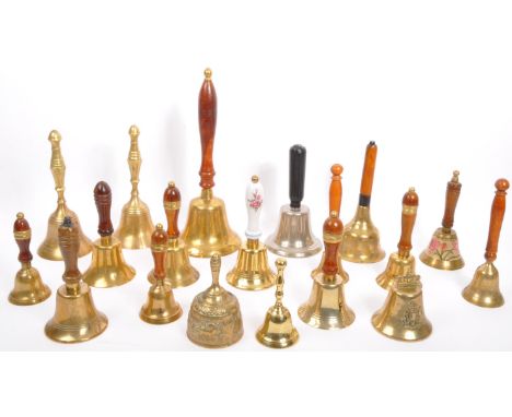 A large collection of vintage brass bells, brass home decor, wooden handled brass bells, crotal bells, along with an aluminiu