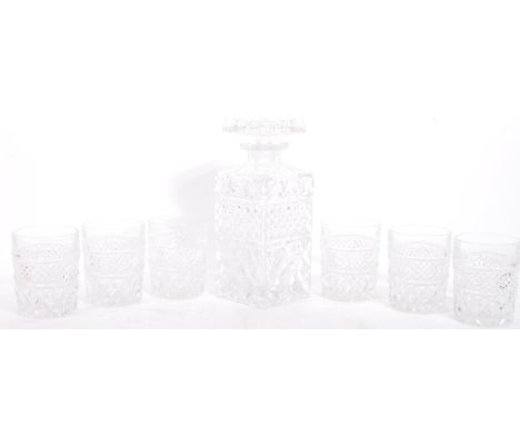 A vintage 20th century liquor glass pressed decanter with six drinking glasses. With square wine / whiskey decanter and stopp