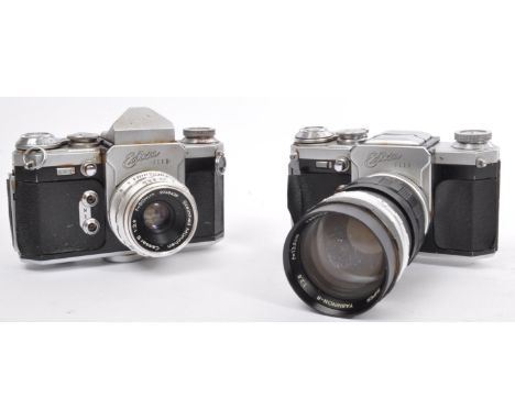 Two retro vintage Wirgin Edixa Flex 35mm SLR cameras. One with a 50mm 1:2.8 Cassarit lens, other with a Yashica, Japan f=13.5