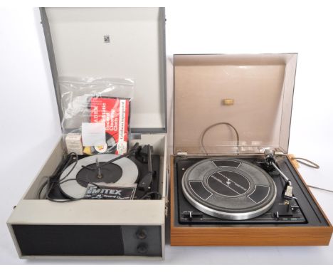 A boxed Garrard model 125sb record deck turntable accompanied by a Portadyne portable record player in two tone grey colourwa