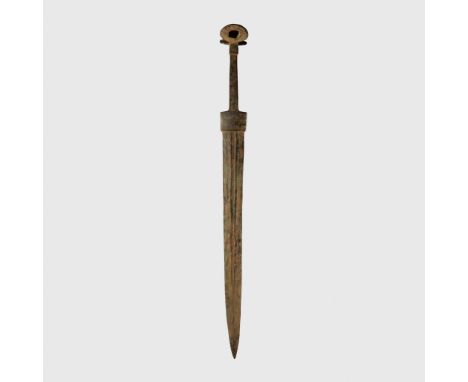 DUAL EAR POMMEL SWORD LURISTAN, 1200 - 800 B.C. cast bronze, slender square handle joining to a pommel that divides into two 