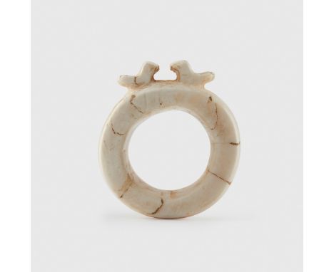 BARAVA RING CHOISEUL, SOLOMON ISLANDS carved tridacna shell, topped by a pair of birds(6.7cm diameter)Footnote: Provenance: P