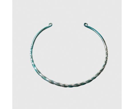 CELTIC TORC WESTERN EUROPE, C. 6TH CENTURY B.C. cast bronze, of twisted construction, the tapering ends with flattened, coile