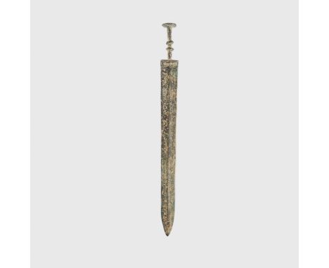 LURISTAN DAGGER LURISTAN, MID - LATE SECOND MILLENNIUM B.C. cast bronze, slender blade with pronounced central ridge, dual ri