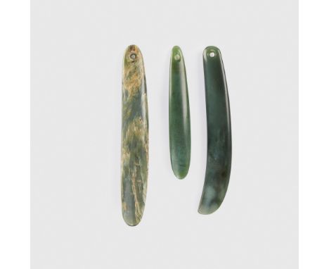 TRIO OF MAORI EAR ORNAMENTS, KURU NEW ZEALAND carved and polished jade, two of elongated oval form, with perforation to the t