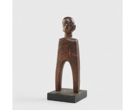 LOBI CATAPULT BURKINA FASO carved wood, of anthropomorphic form, the attachment frame forming the legs, rising to a neck and 