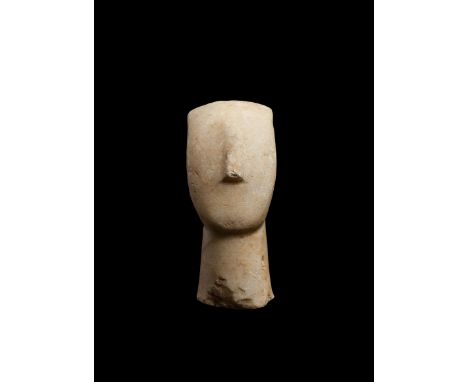 CYCLADIC IDOL HEAD CYCLADES, EARLY CYCLADIC II, C. 2600 - 2400 B.C. carved marble, the head upon a broad cylindrical neck, th