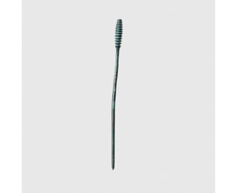 BRONZE AGE PROBE EUROPE, C. 1200 - 800 B.C. cast copper alloy, narrow handle with spiral shaped head, fine green patina(16.5c