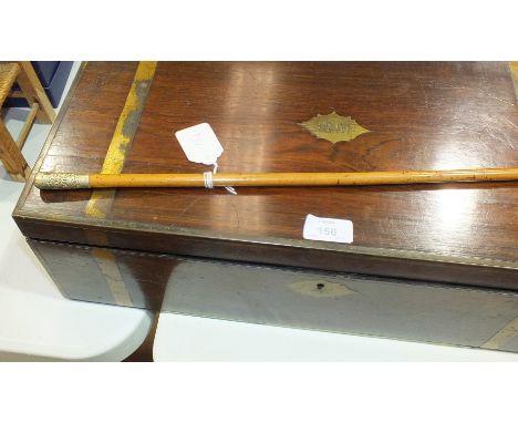 A late-19th century brass-bound rosewood writing slope, 50cm wide and a swagger stick, (2).