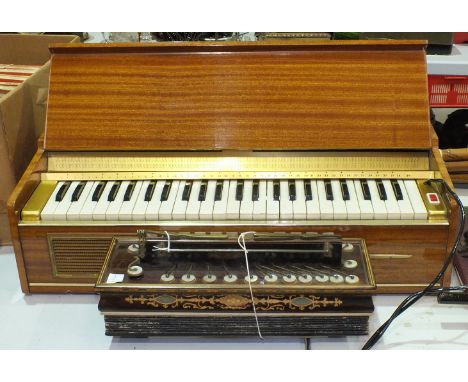 A Busilacchio electric keyboard, (legs lacking) and a 19th century Busson, Paris, Flutina accordion, (2).