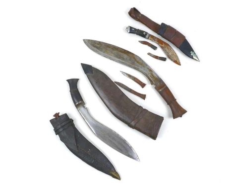 A group of three Kukris, largest measuring 34cm blade length, 44cm overall, a GMR, Number four, mark Two bayonet, a machete w