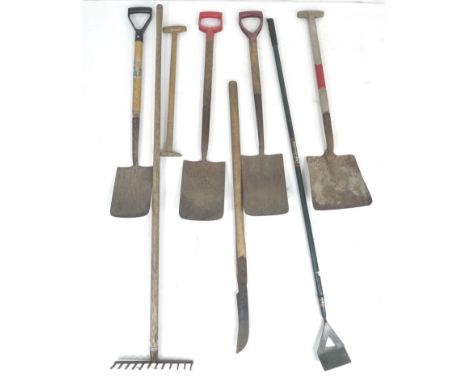 A group of garden tools, comprising four spades, a hoe, a rake, a garden slasher, and a wooden handle. (8) 