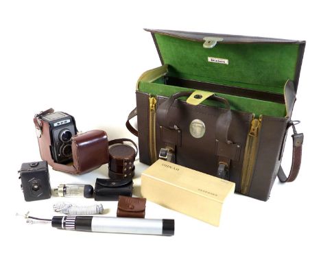 A small collection of camera equipment, comprising a SEM FX camera, number 425092, with two lenses marked 'SOM Berthiot N9723