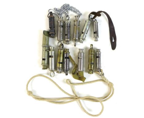 A collection of Victorian and later metal whistles, including some military, one with MoD broad arrow marked 'J. Hudson & Co 