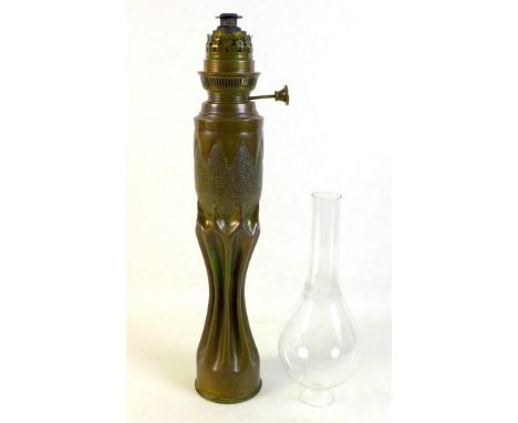 An Art Nouveau/Secessionist trench art oil lamp, of organic, fluted waisted form below planished ovoid, fitted with a burner 
