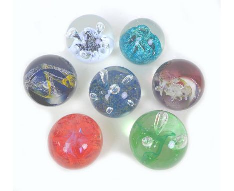 A group of six Caithness glass paperweights, comprising Moonflower, F94328, Moon Orchid, number 533 of 1060, Inferno, E5004, 