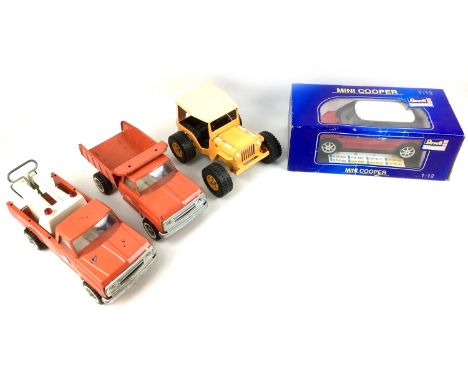 A Revell Metal 1:12 scale Mini Cooper, with original box, and three Tonka vehicles, without boxes, in a playworn condition. (