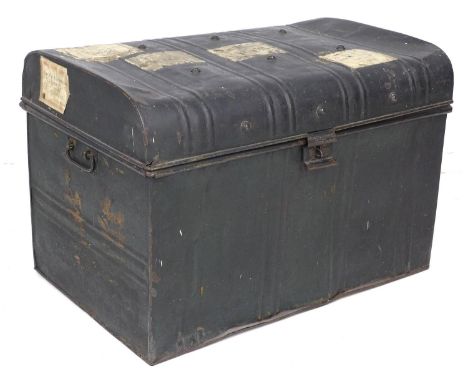 An early 20th century metal travelling trunk, with various shipping labels, some for ?Stamford?, 72 by 48 by 48.5cm high. 