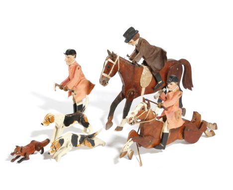 A CARVED AND PAINTED WOOD HUNTING GROUP IN THE MANNER OF NEW FOREST TOYS EARLY 20TH CENTURY with two horse and riders, a sing