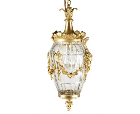 A FRENCH GILT BRASS HALL LANTERN IN LOUIS XVI STYLE LATE 19TH / EARLY 20TH CENTURY the panelled glass body applied with ribbo