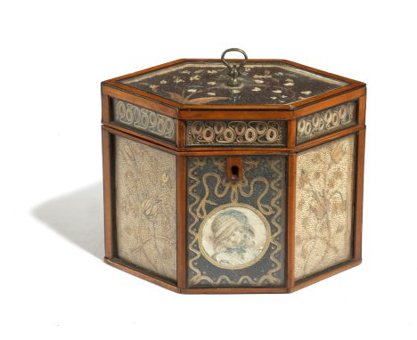 A GEORGE III SATINWOOD HEXAGONAL SCROLLWORK TEA CADDY LATE 18TH CENTURY with glazed panels decorated with coloured and gilt r