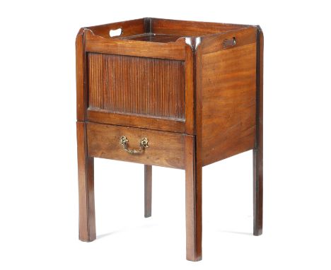 A GEORGE III MAHOGANY TRAY-TOP BEDSIDE COMMODE LATE 18TH CENTURY the gallery top with pierced handgrips, above a tambour shut