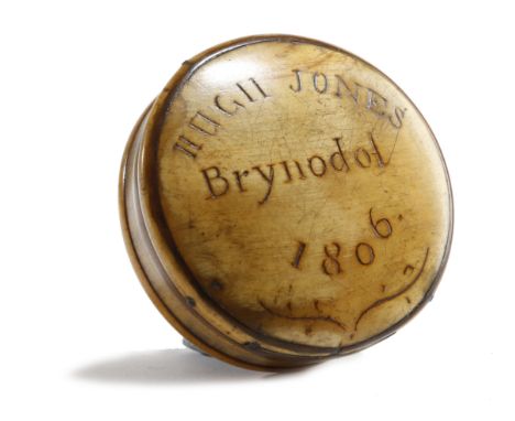A GEORGE III WELSH HORN SNUFF BOX EARLY 19TH CENTURY the lid inscribed and dated 'Hugh Jones Brynodol 1806' 6.8cm diameter PR