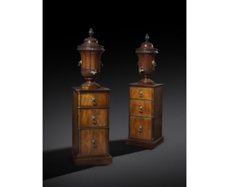 A PAIR OF GEORGE III MAHOGANY DINING ROOM URNS AND PEDESTALS IN THE MANNER OF GILLOWS c.1775-80 each urn of campana shape, wi