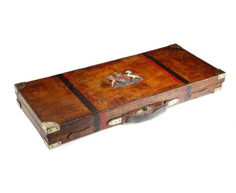 A BROWN LEATHER SHOTGUN CASE LATE 19TH CENTURY with brass corners, the hinged lid emblazoned with a later transfer print of t