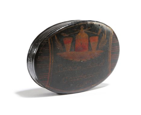 AN 18TH CENTURY WELSH PONTYPOOL TIN OVAL SNUFF BOX black japanned and decorated in gilt with a decanter flanked with a pair o