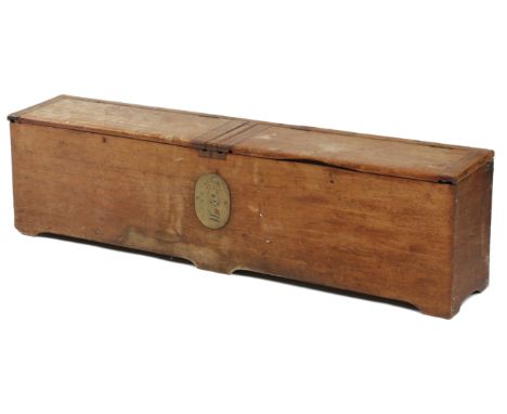 A VICTORIAN TEAK SHIP'S STORAGE TRUNK with twin hinged lids revealing a vacant interior, the front with an applied brass plaq