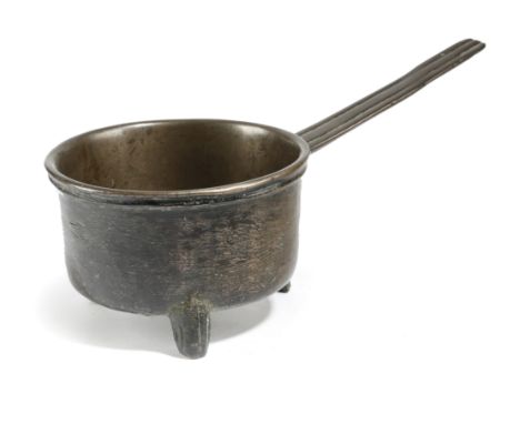 A CHARLES II BRONZE SKILLET BY ROBERT FLOWEREE SALISBURY, c.1671-79 the body decorated with scratchmarks with a vine meander 