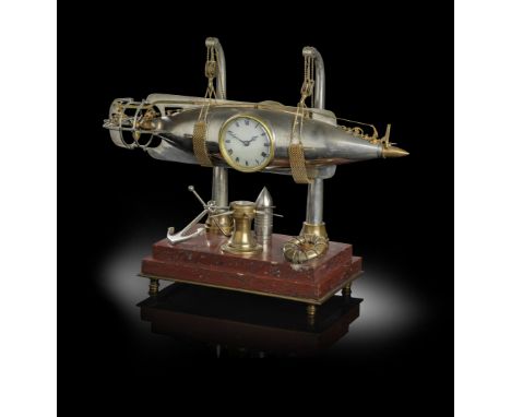 A RARE FRENCH BRASS AND SILVERED TORPEDO INDUSTRIAL TIMEPIECE WITH AUTOMATON LATE 19TH / EARLY 20TH CENTURY with an automaton