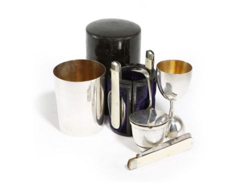 λ A VICTORIAN CAMPAIGN OFFICER'S CUTLERY SET LATE 19TH CENTURY the leather case containing: a beaker, with four folding ivory