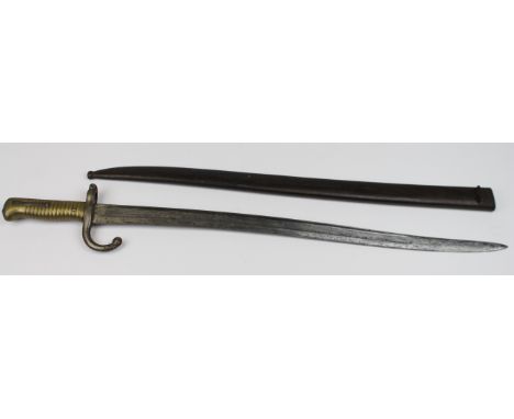 Bayonet: A model 1866 Chassepot Sabre bayonet. In its steel scabbard. Blade 22.5. Made at St. Etienne in August 1874. A decen