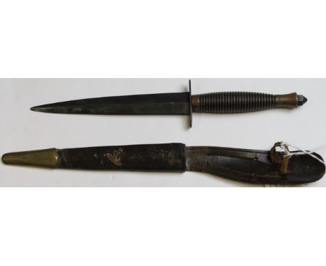 Knife: A 3rd Pattern 'F.S.' Commando fighting knife. A post war example by J. Nowill & Sons (makers mark crossed keys & 8D to