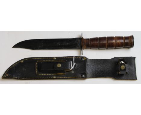 Knife: A modern copy of a U.S. KA-BAR Combat knife. In its leather scabbard with sharpening stone. Leather washer grip. The w