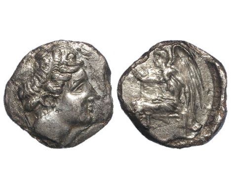 Ancient Greek silver stater of Bruttium, Terina, Head of Hera Lakinia wearing stephanos / Nike seated left, holding wrearh [o