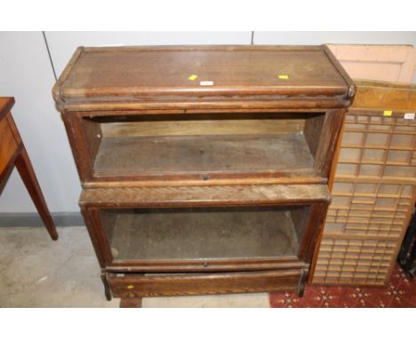Oak two tier glazed barrister's bookcase, (one glazed panel missing), 100 cm x 87 cm x max depth 36 cm
