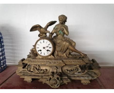 Gold coloured metal figural mantle clock, 45 cm long, 35 cm high 