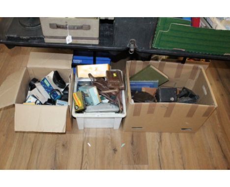 3 boxes of vintage camera equipment including light meters, camera hoods, boxed cameras and other equipment
