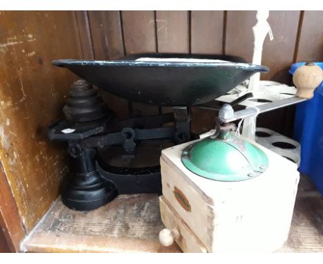 A cast iron egg stand, a French coffee grinder and a set of vintage enamelled scales with weights 