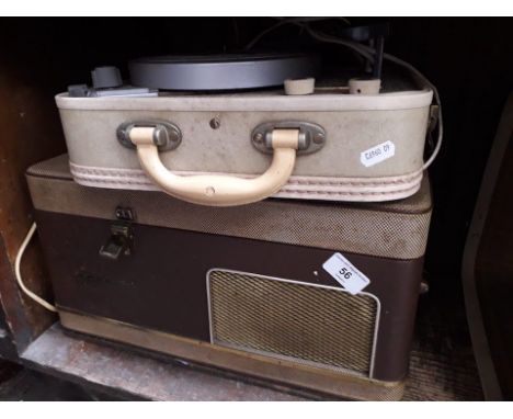 A vintage record player and a reel to reel tape player 