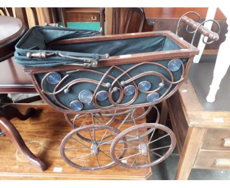 A vintage dolls pram 