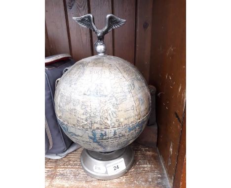 A musical globe bar containing 6 amber coloured glasses and decanter having bird mounted on top, together with an old flat ir