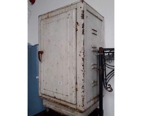 A vintage metal meat cupboard 