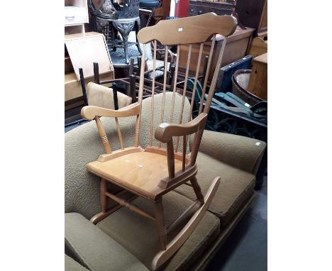A modern light wood rocking chair 